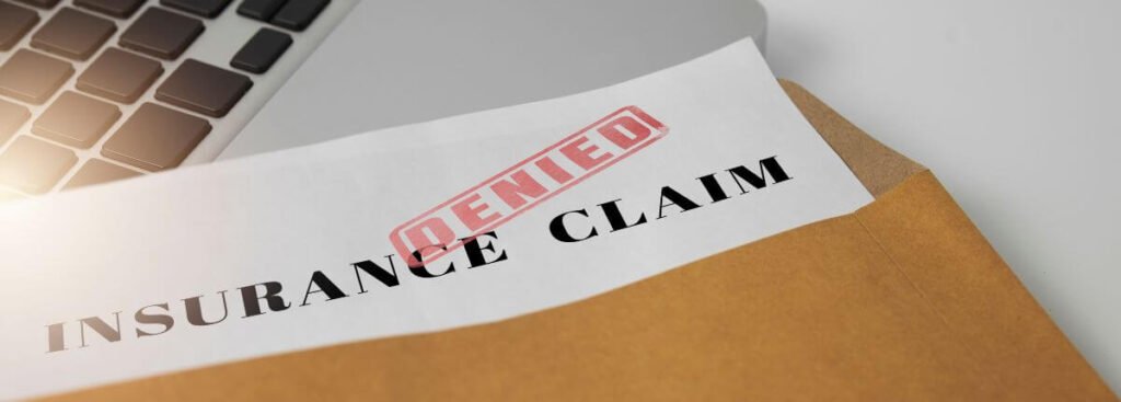 envelope with insurance claim denial form