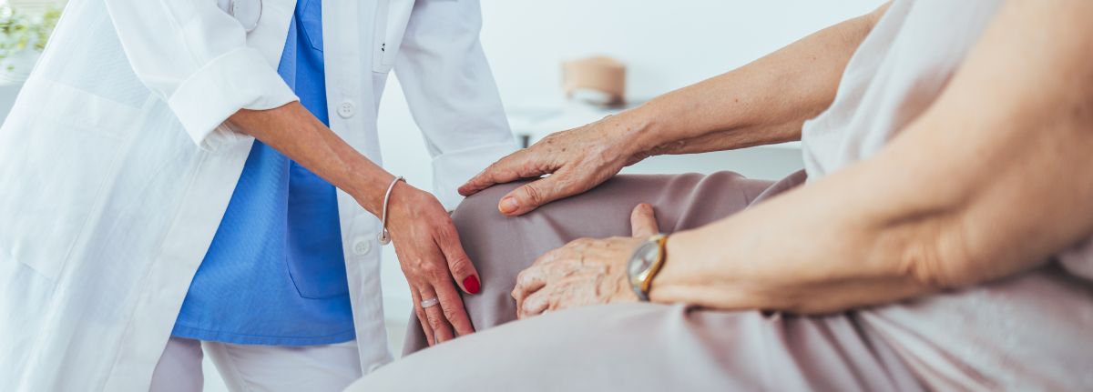 doctor examining patient's knee