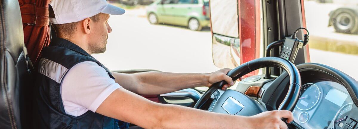 young commercial truck driver at intersection