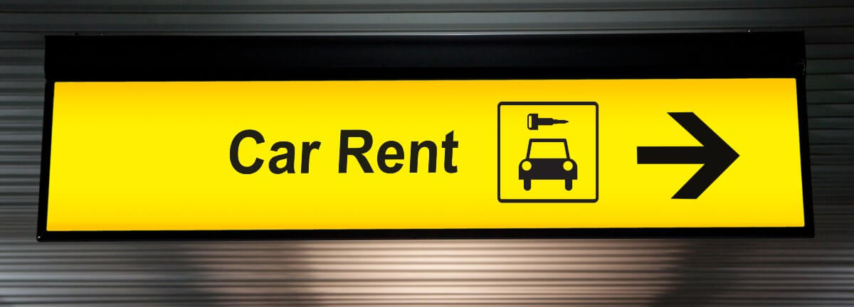 yellow car rental sign