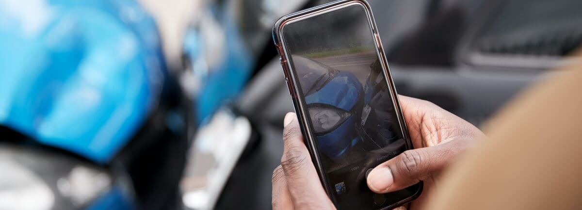 using smartphone to take pics of car crash