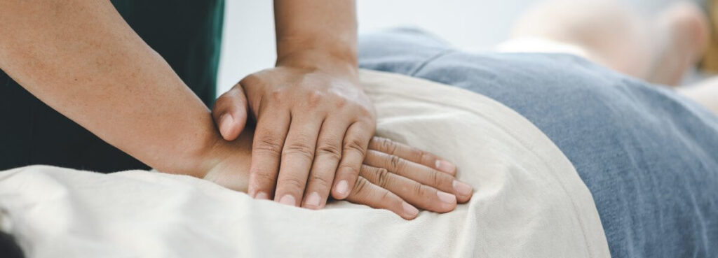 massaging patient's back